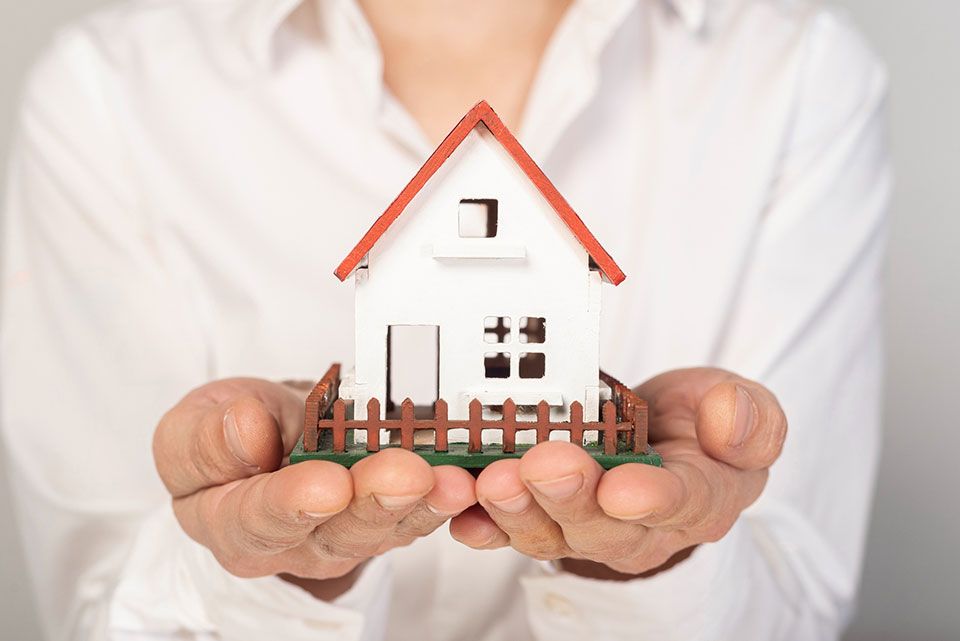 woman holds property